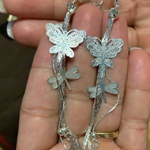 Woman’s long butterfly earrings